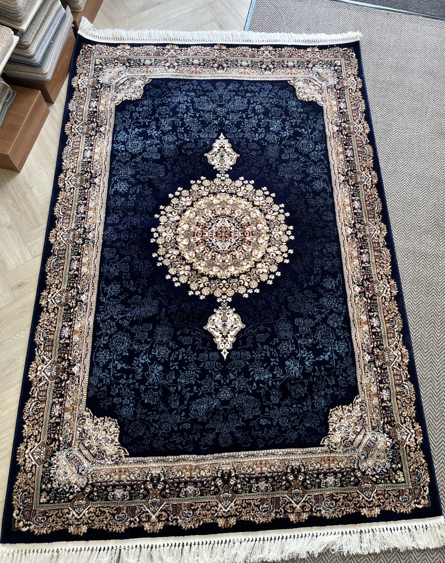 Persian and Turkish rugs on display at The Waldorf Carpets showroom in Maida Vale